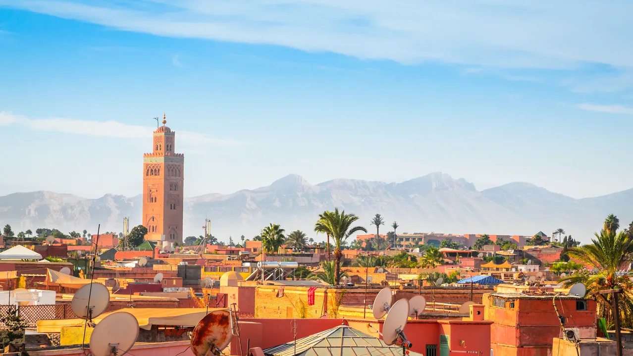 Marrakech’s old medina and the Koutoubia minaret, with the Atlas Mountains on the horizon