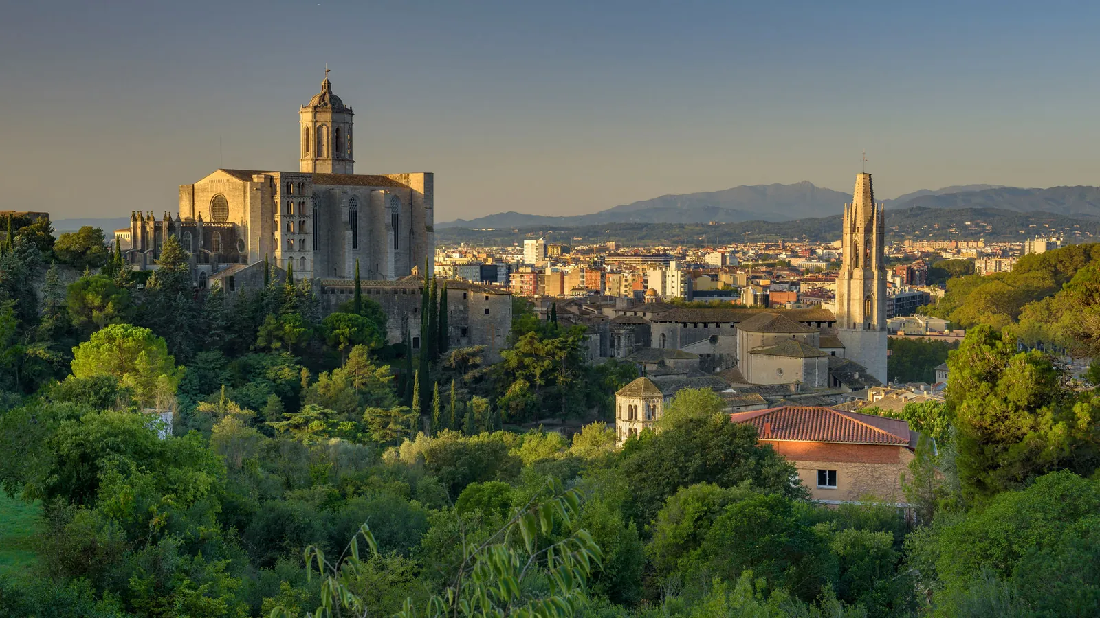 Panoramic view over the cathedral and old town of Girona in Catalonia in warm evening light