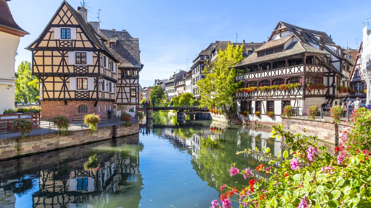 Half-timbered houses reflected in the canal in the Petite France quarter of Strasbourg